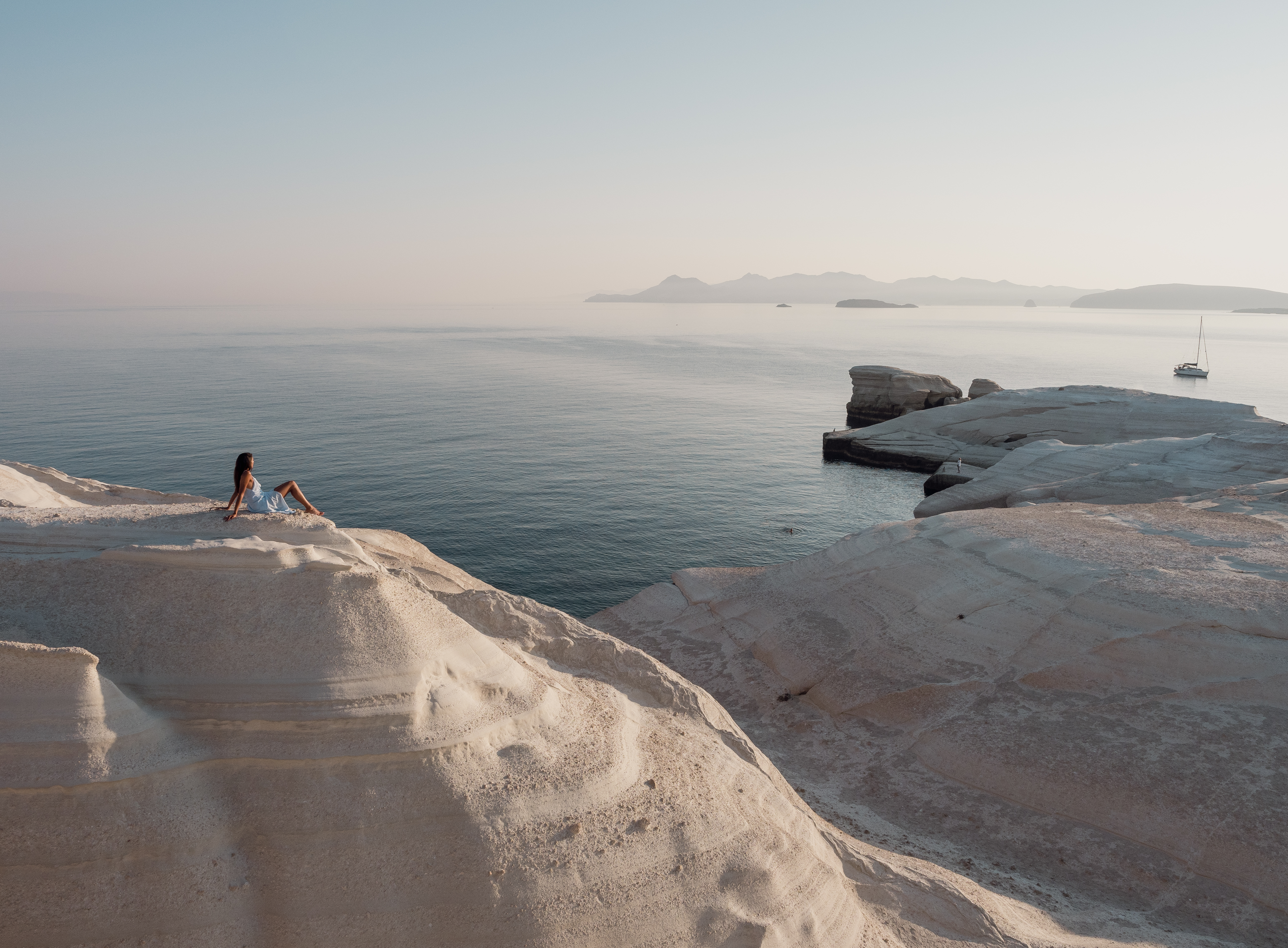 young woman at white limestone beach sarakiniko on 46cff4897beb9dc7c58f BTOURS