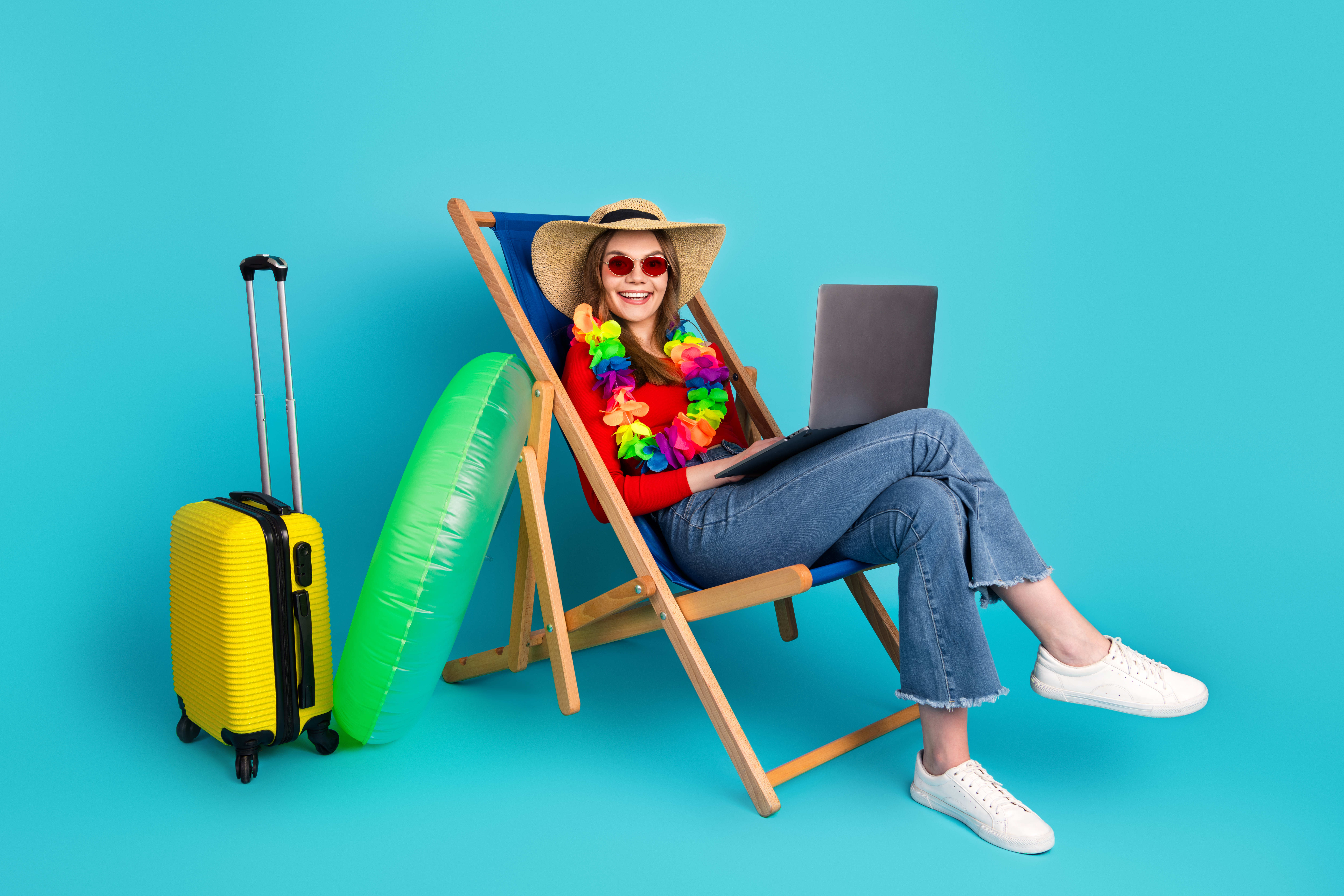 Balancing Wanderlust and Work: Tips for Women Building Travel Careers 1 young woman in summer fashion using laptop in a be 4527d2a8911714be7850
