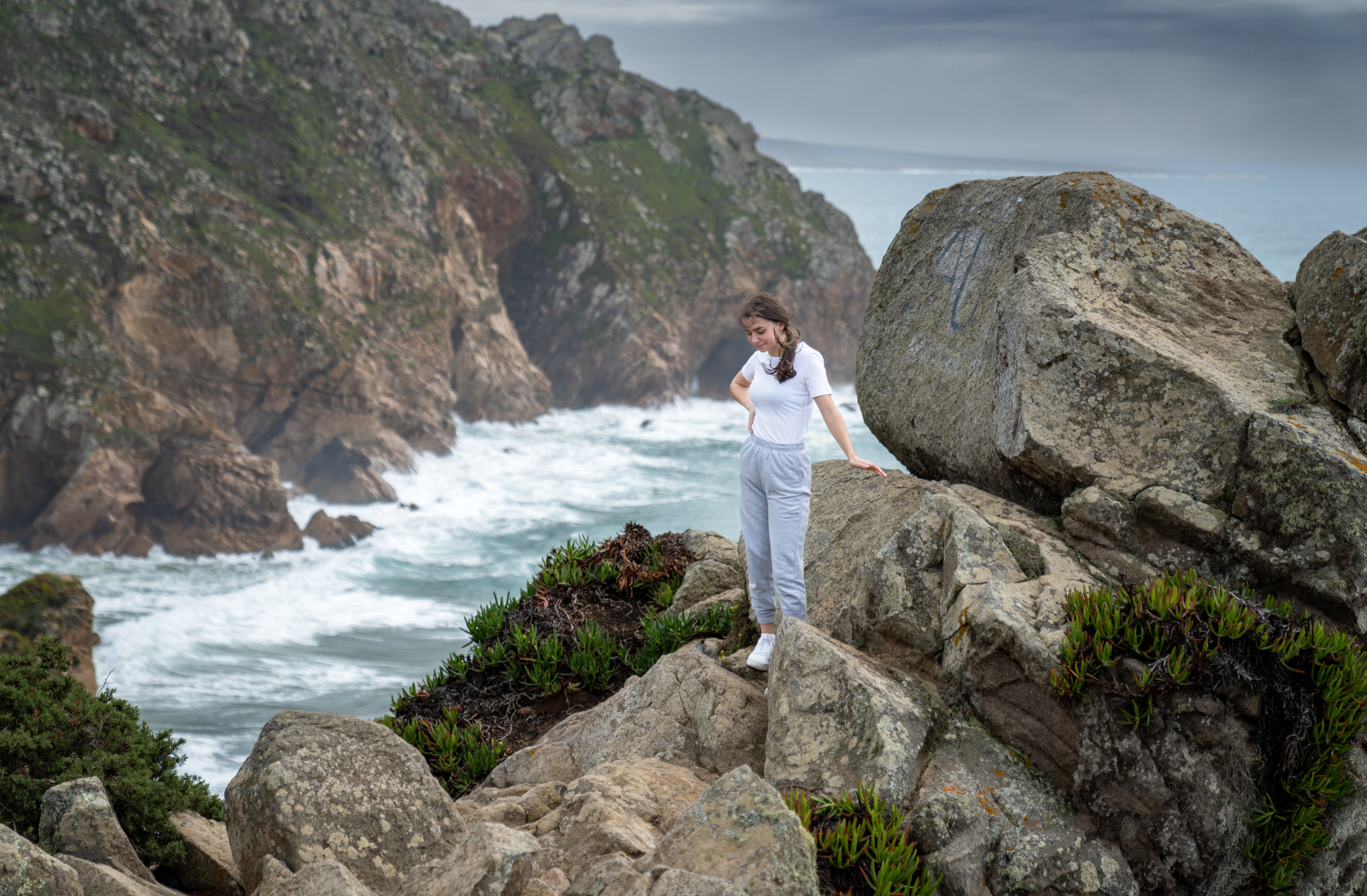 young woman relaxing by coastal fence with scenic bc20381809d8d6a9014d BTOURS