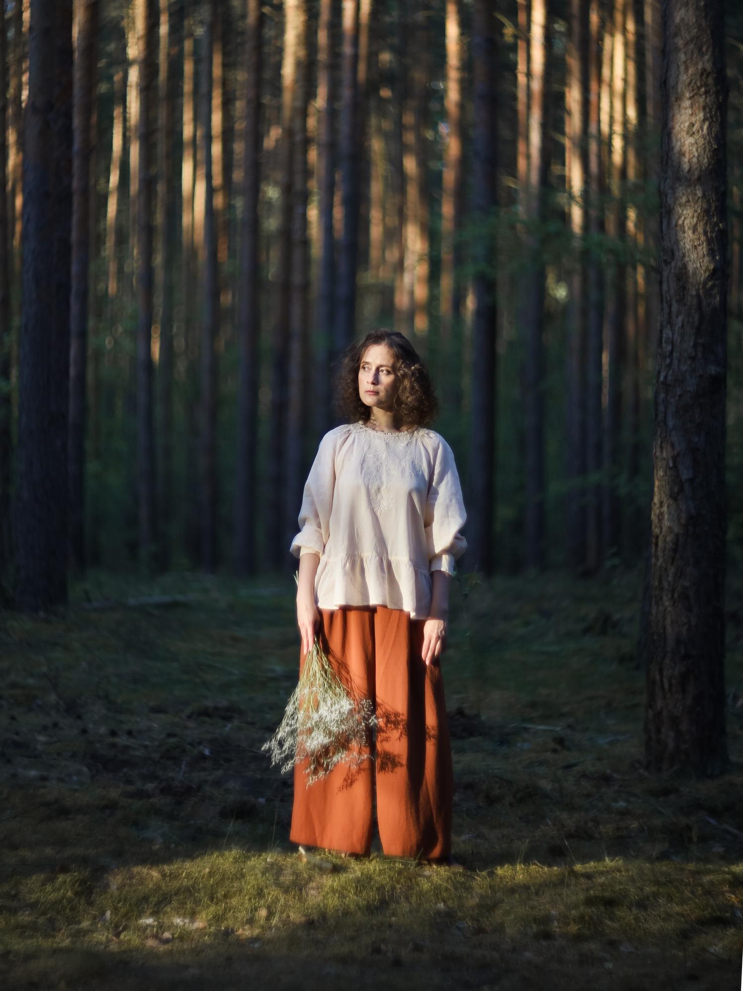 young woman standing in forest 9171c4d76f9ba2a7df89
